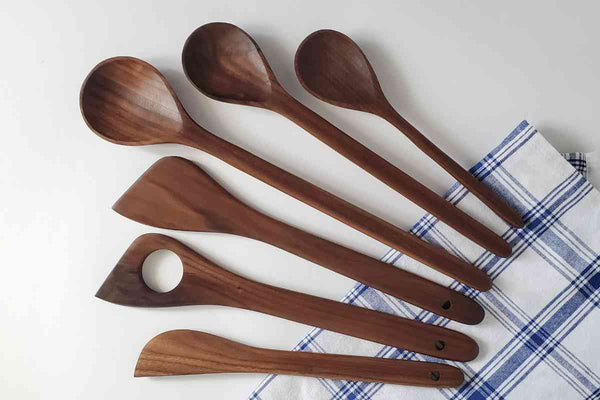 set of six walnut cooking utensils