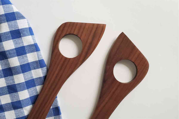 detail of left and right handed spatula with hole