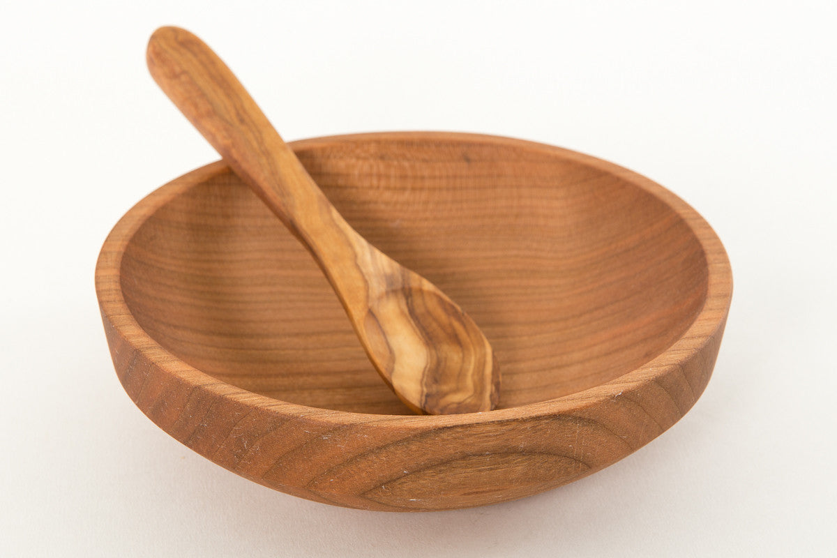 small wooden bowl with wooden baby spoon