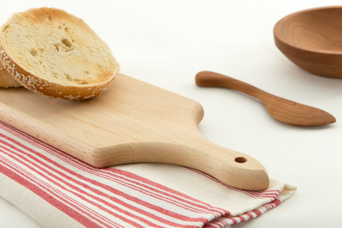 White Fresh Baguette Is Light On Wooden Boards Stock Photo